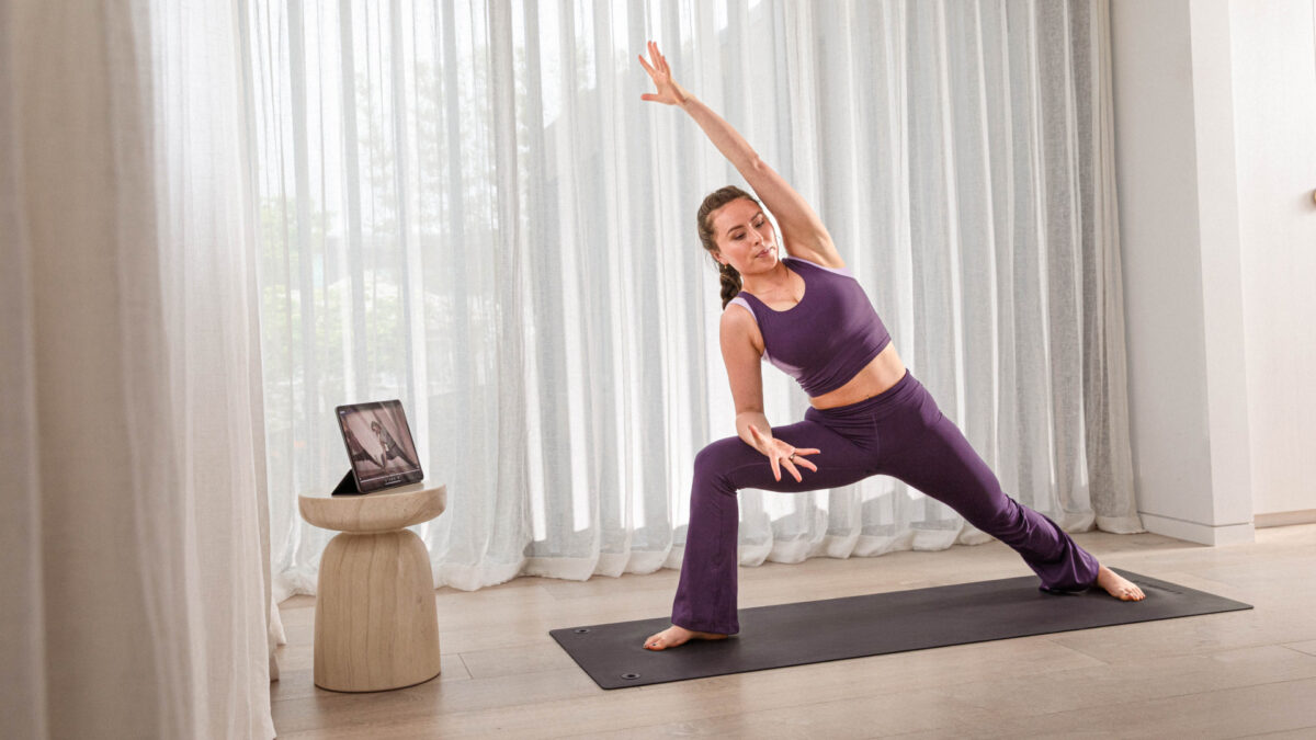 Woman performing yoga at home