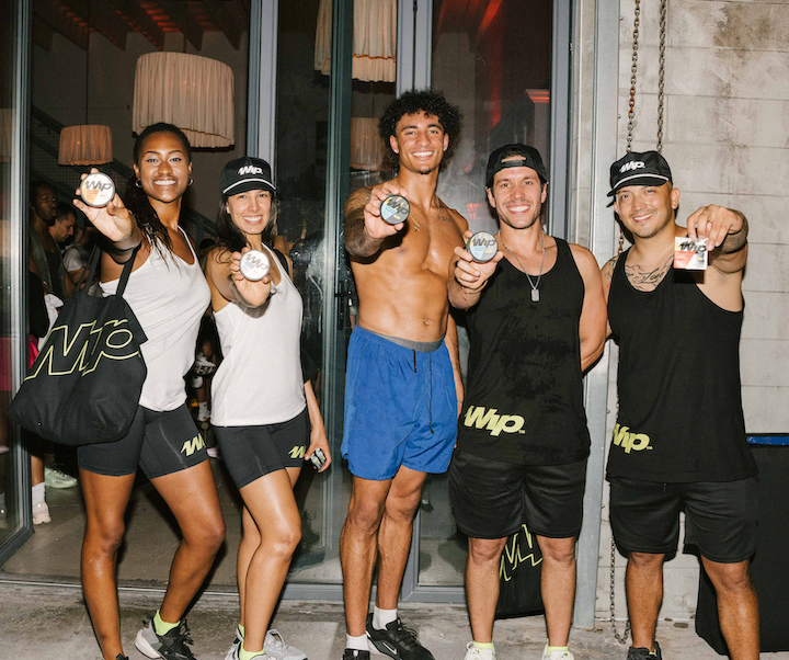 Group of people holding Wip canisters