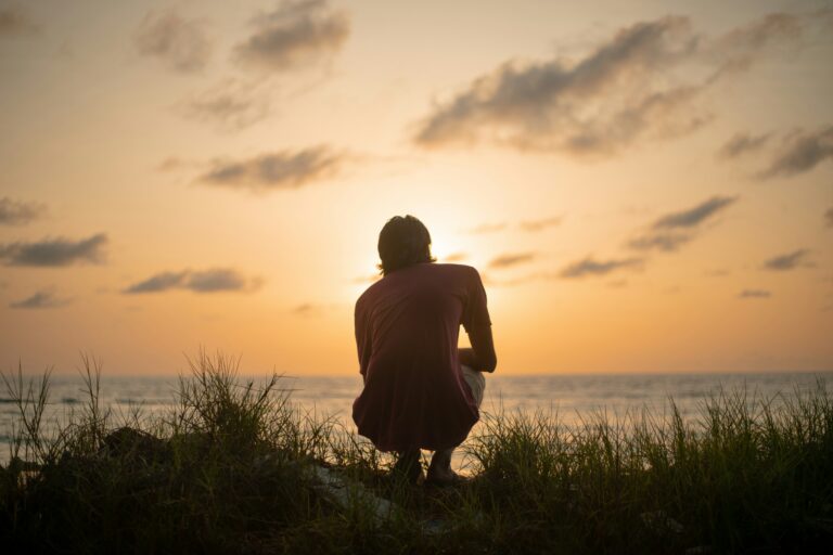 Man alone by the coast contemplating
