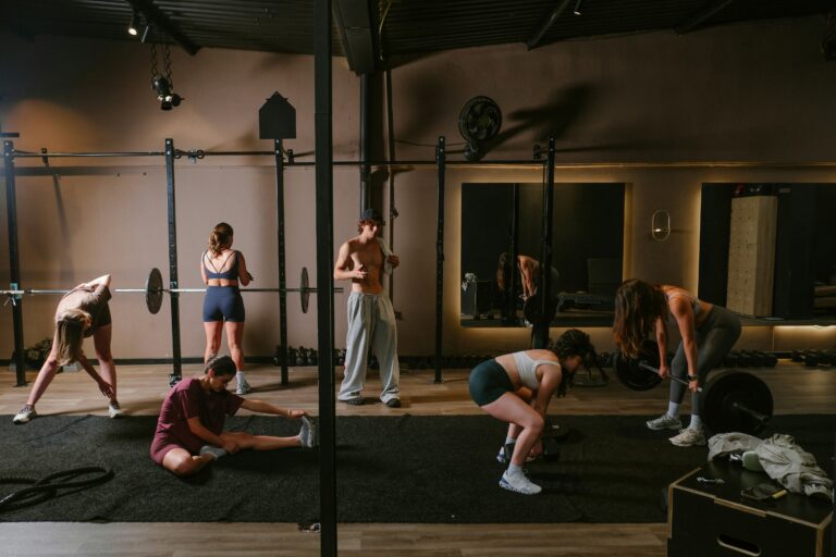 People exercising in a modern gym with weights