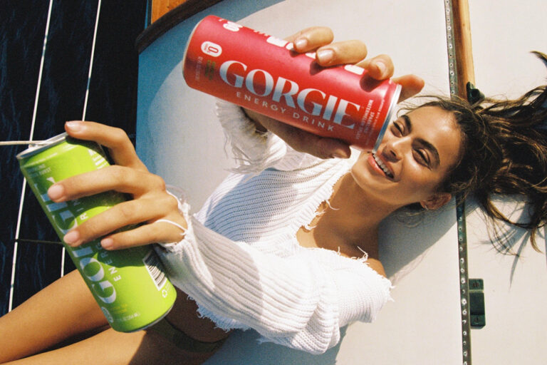 Woman holding cans of GORGIE