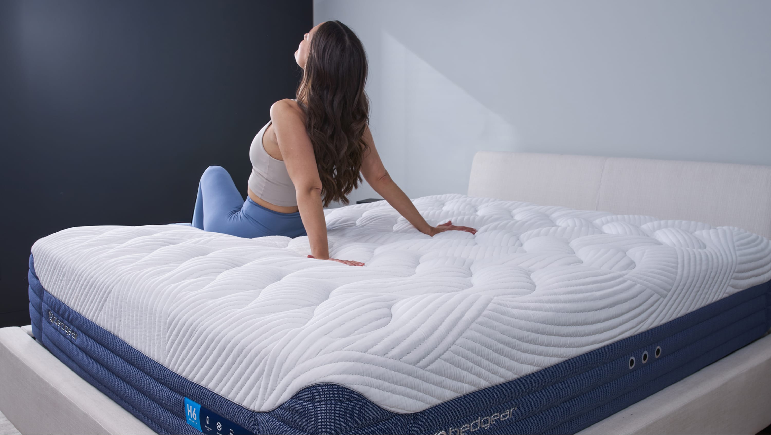 Woman sitting on BEDGEAR mattress