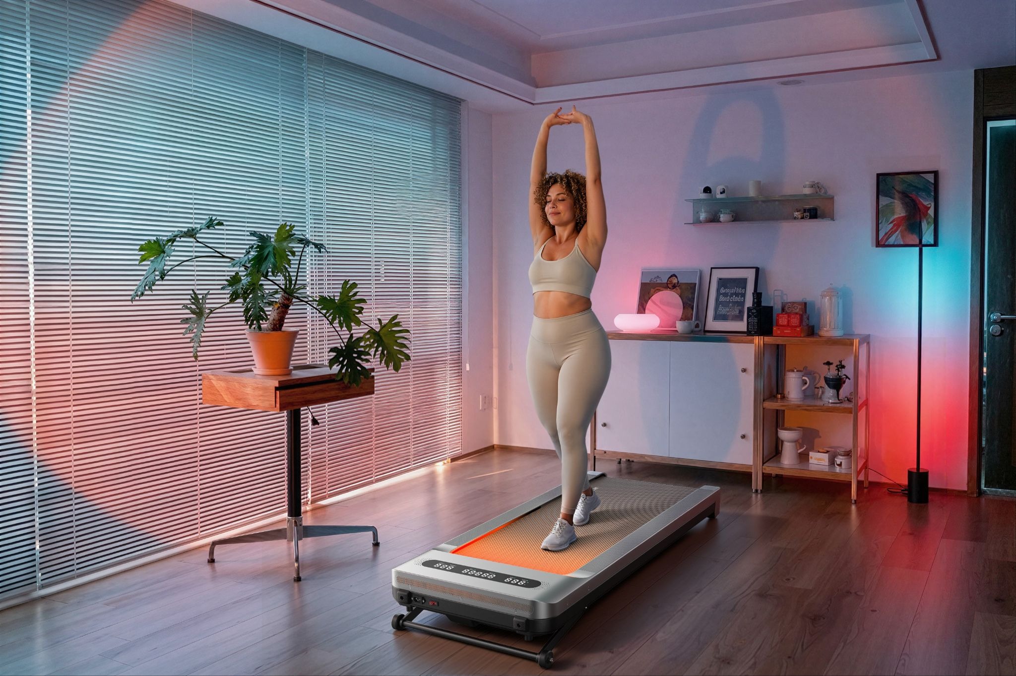 Woman at home walking on the Merach UltraWalk W60 Plus walking pad