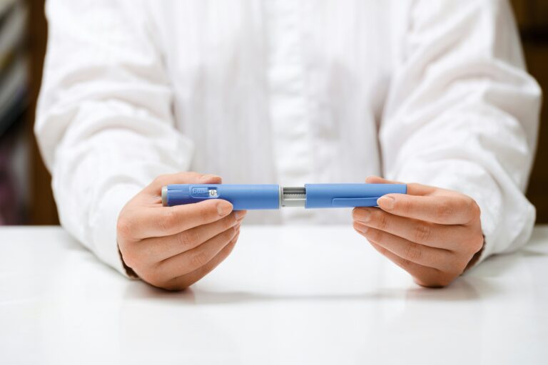 Female hands holding a semaglutide injection
