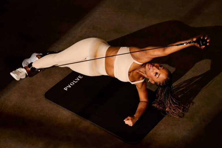 Woman performing a Pvolve workout