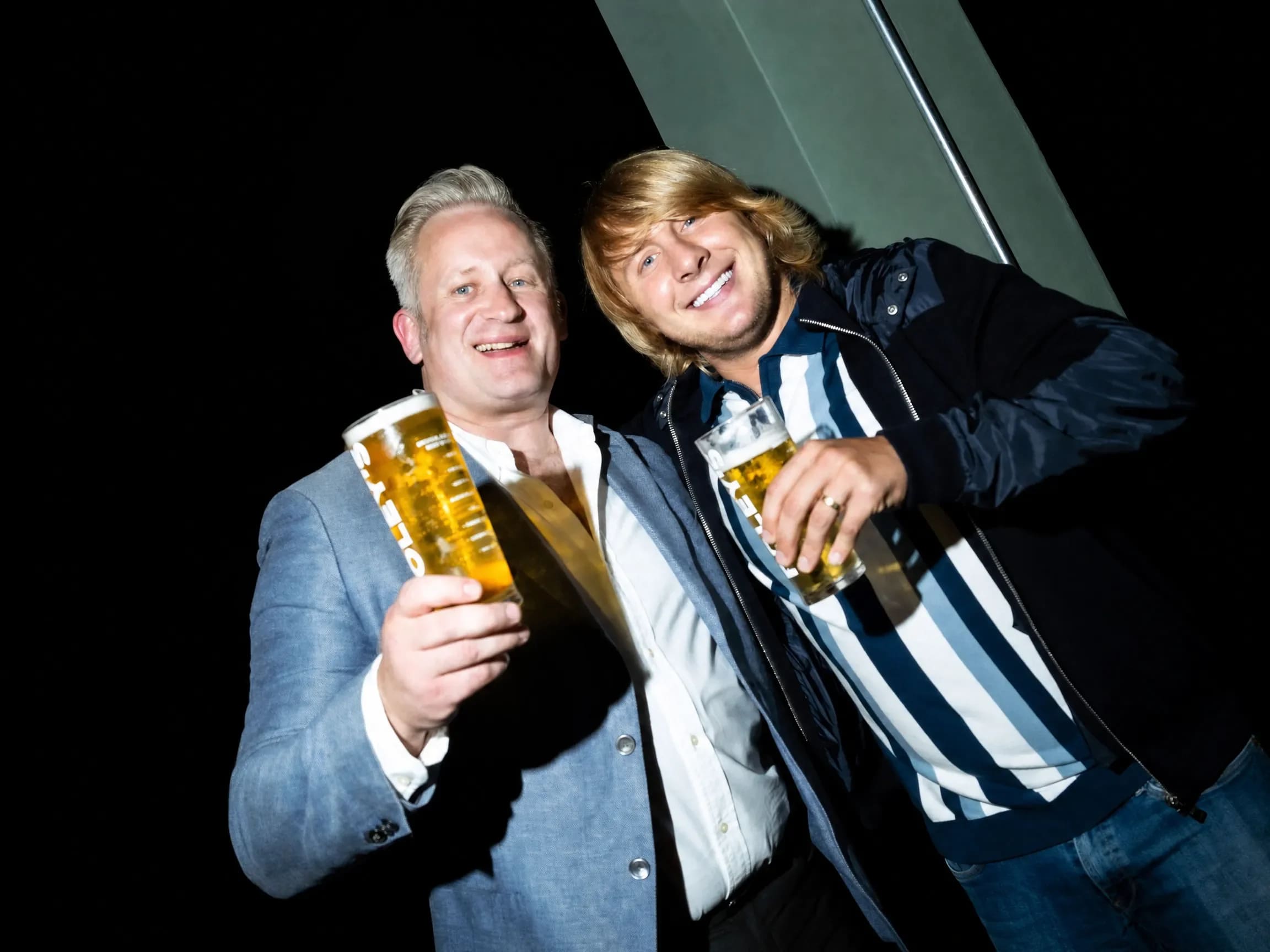 Two men drinking beer