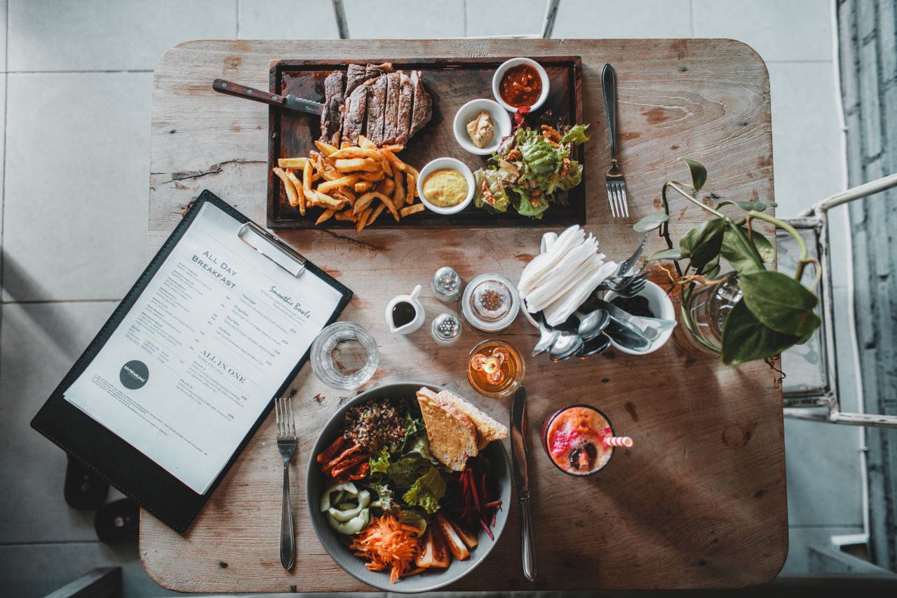Dinner table with Count My Plate app open on a tablet