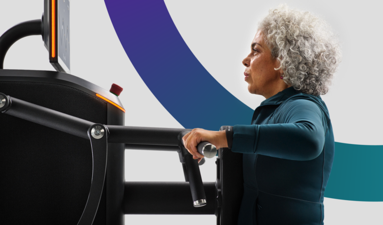 Older woman using an EGYM strength training machine