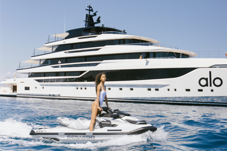 Model jet skiing next to Alo Yacht
