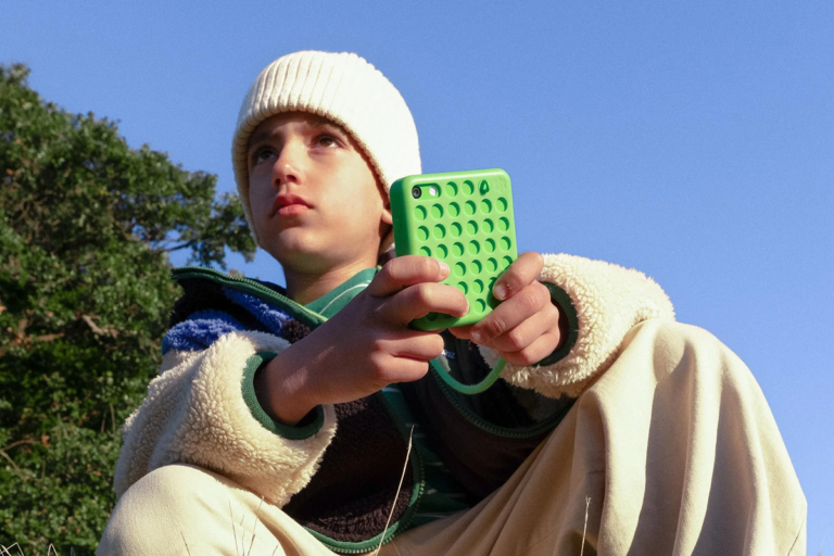 Young boy with a Freckle phone