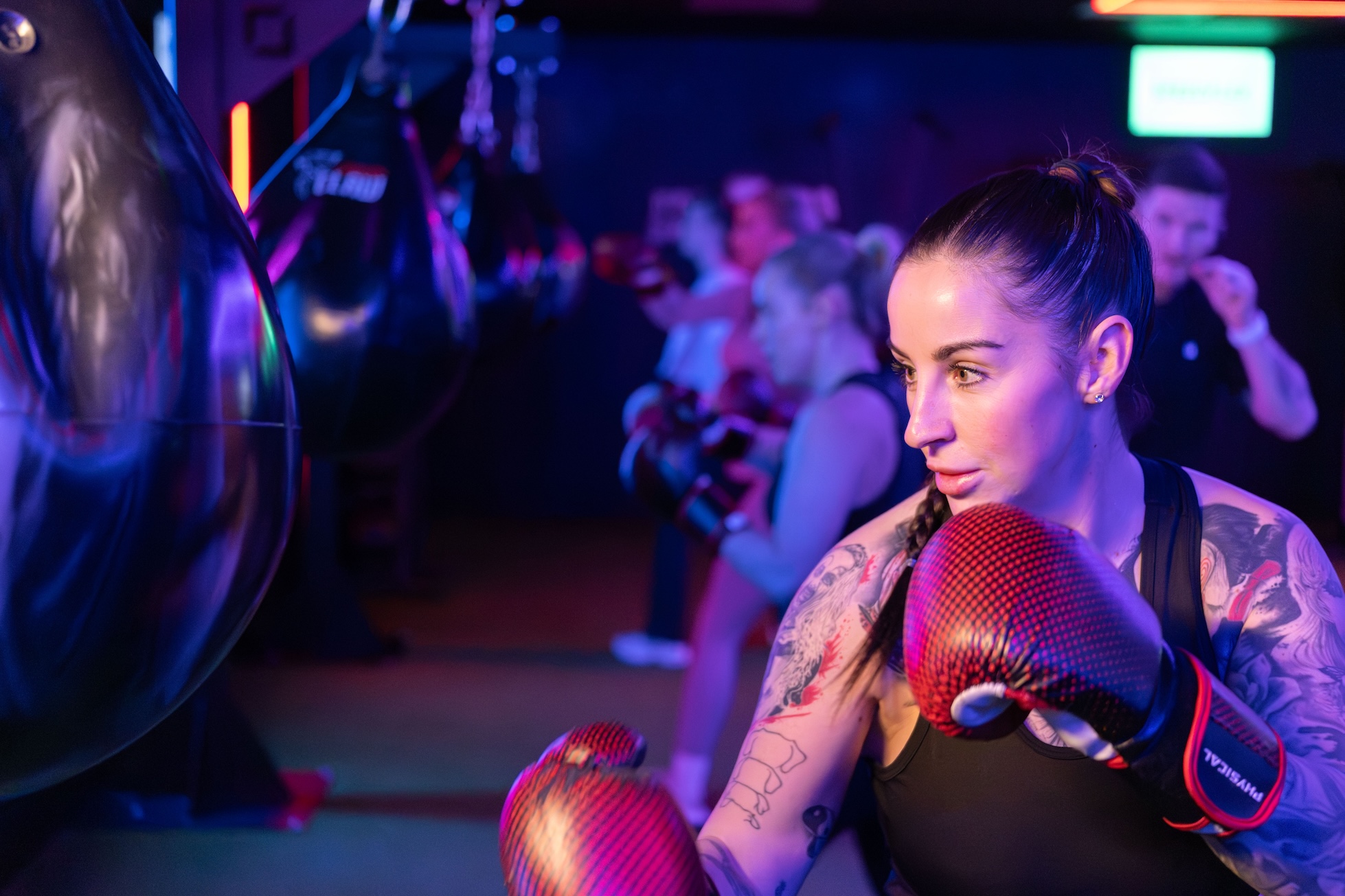 Woman participating in a boxing fitness class