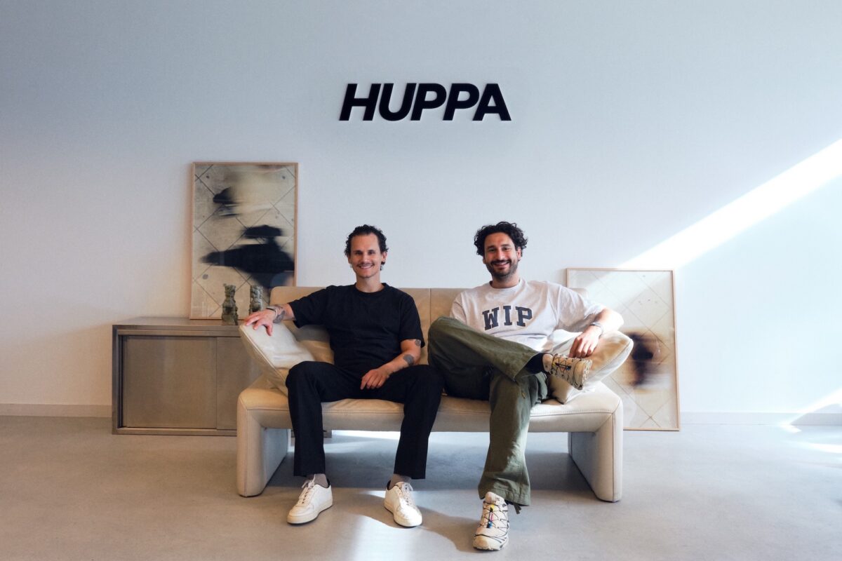 Huppa founders sitting on a couch