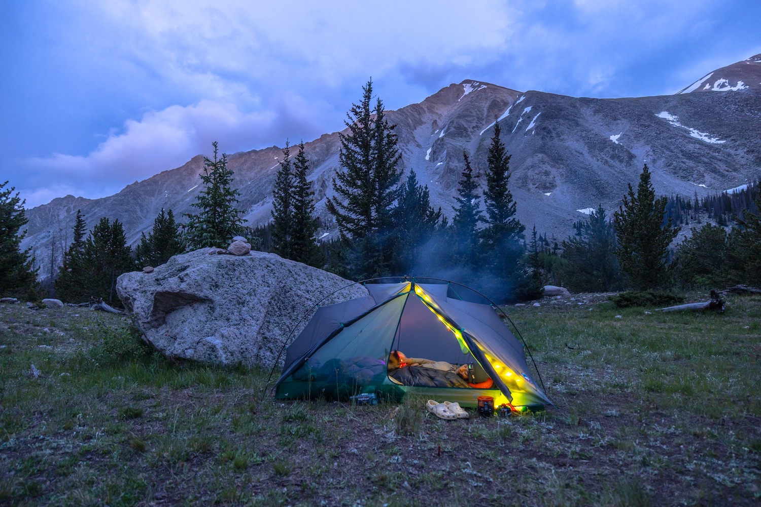 Tent set up in front of mountains