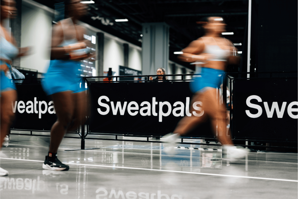 HYROX runners with Sweatpals banner