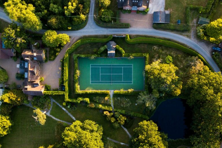 Birds-eye view of a neighborhood with a tennis court
