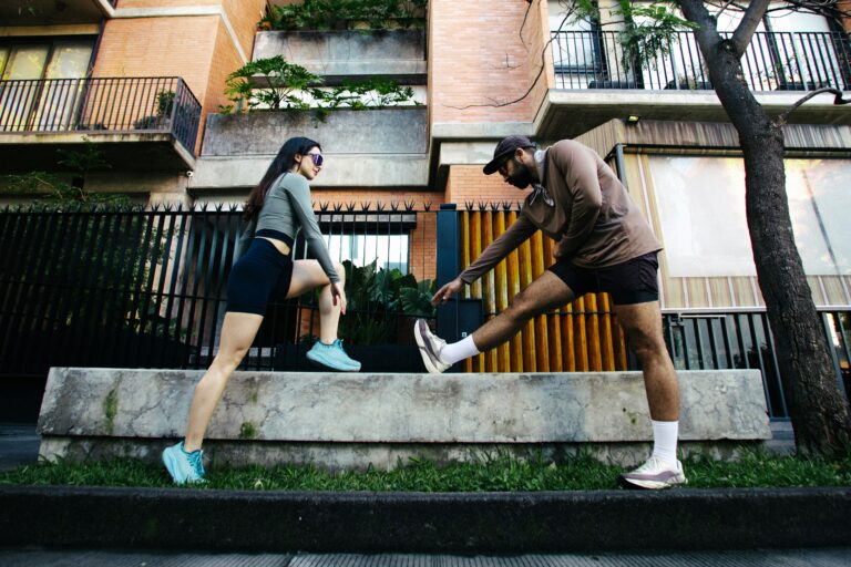 Two people stretching before a run