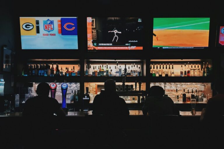 Group of people watching sports at a bar